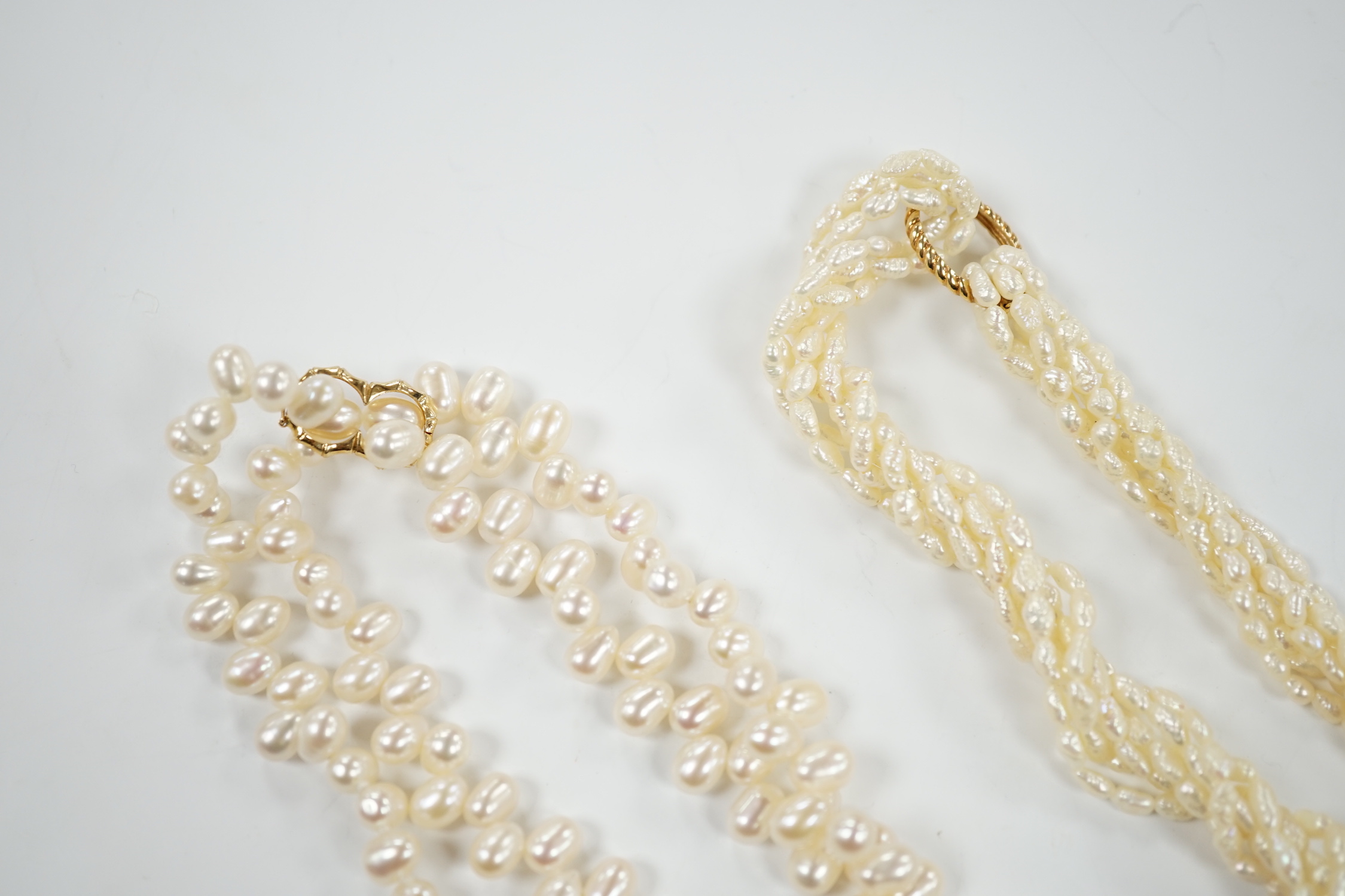 A double strand freshwater pearl necklace, with 585 yellow metal clasp, 50cm and one other freshwater pearl necklace with 585 yellow metal clasp.